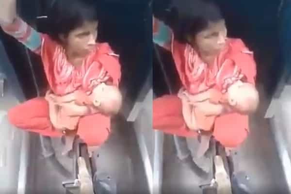 ஊரடங்கால் ரயில் பெட்டி இணைப்பில் குழந்தையுடன் பயணிக்கும் பெண் ?| இந்தியாவைச் சேர்ந்தது அல்ல.